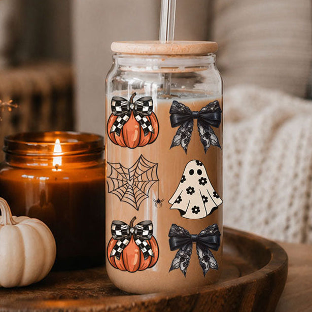 Close-up of a 20oz Halloween drink jar with straw, wooden lid, pumpkins and bats pattern